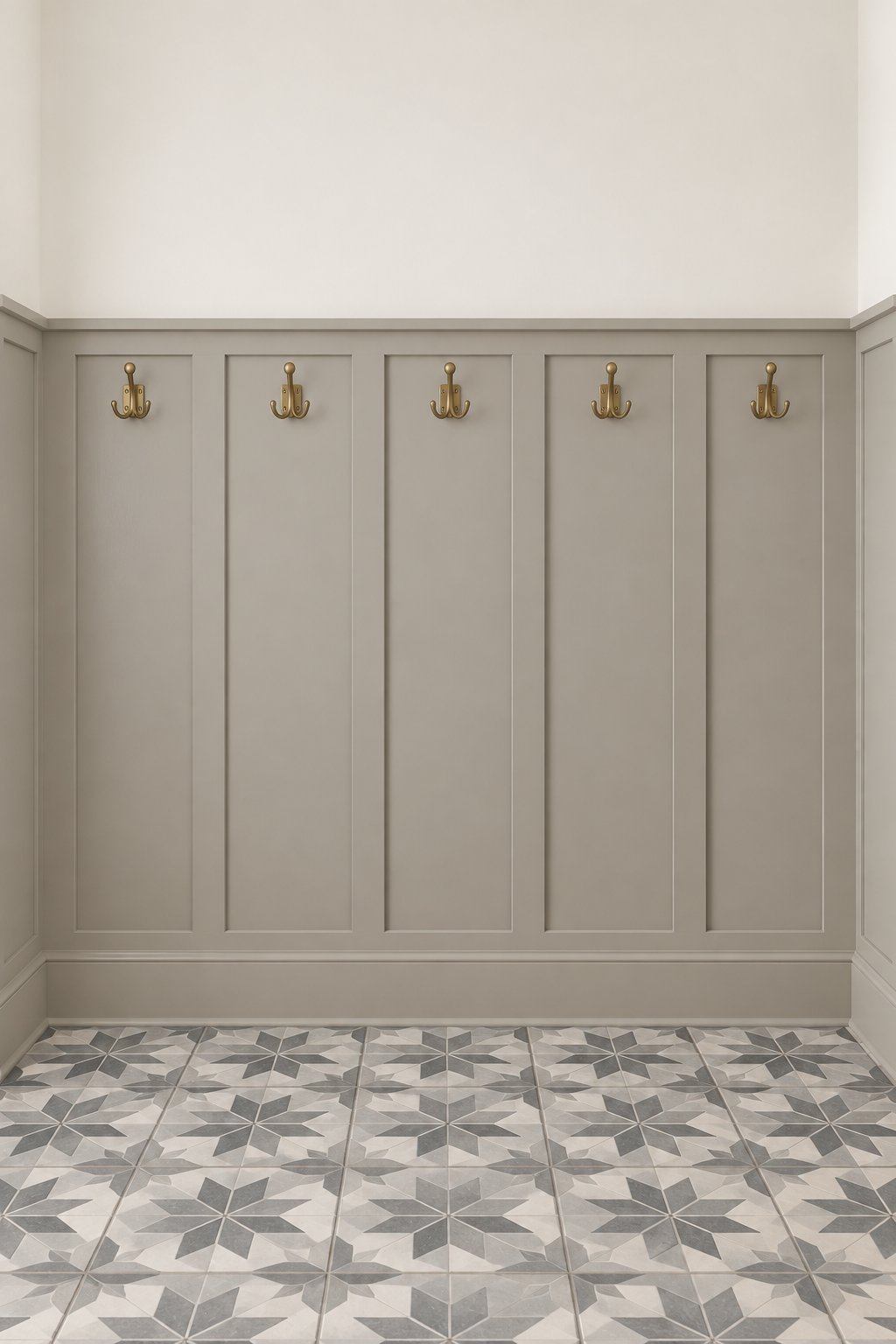 A mudroom with paneled walls, coat hooks, tiled flooring, and upper walls.